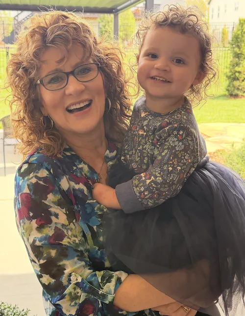 Tamera holding her granddaughter on Easter, 2026.