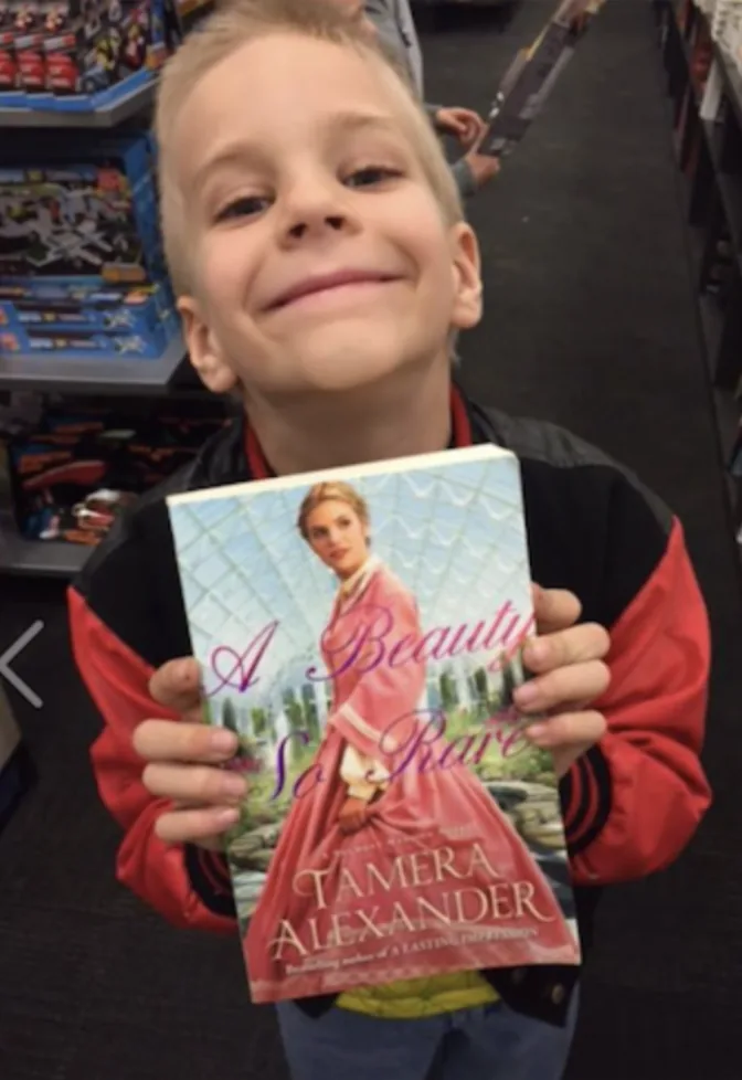 The precious son of Carl & Heather Cartee. They were out shopping, saw a copy of the book, and snapped a pic. Sweet!