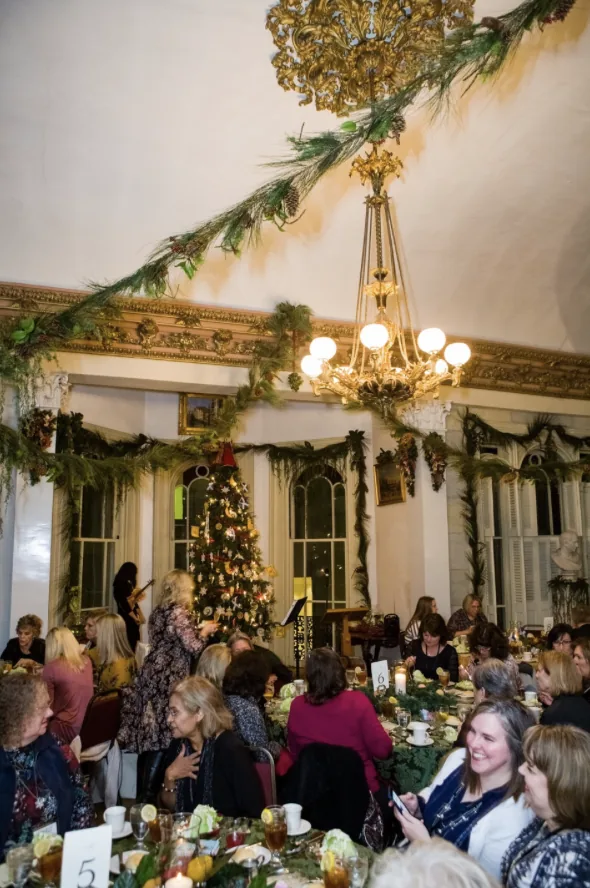 Guests dining beneath chandeliers inside Belmont Mansion during the Southern Mansion Reader Weekend