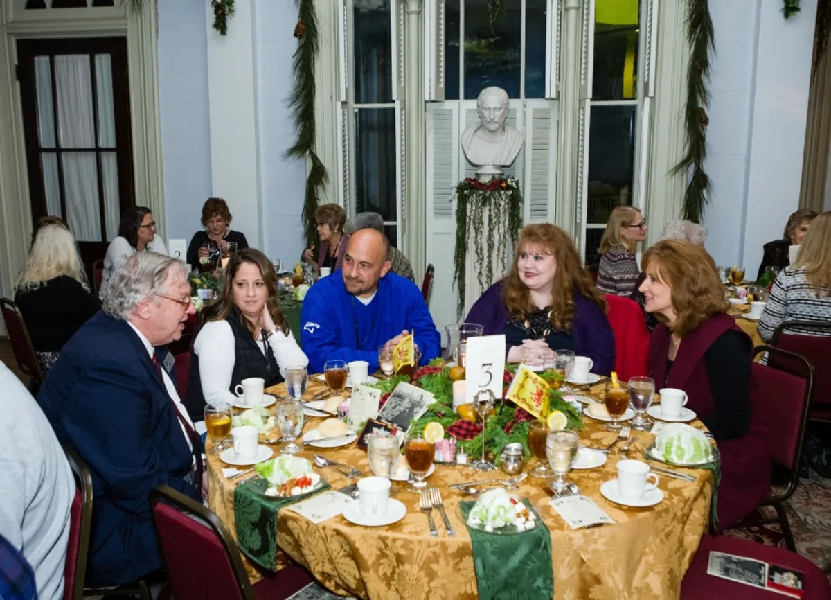 Southern Mansion Reader Weekend guests seated together around a dinner table