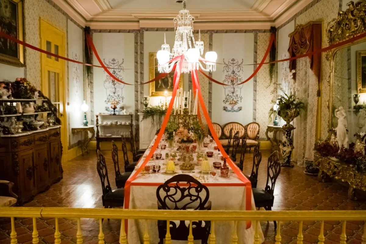 A formally set dining table inside Belmont Mansion during the Southern Mansion Reader Weekend