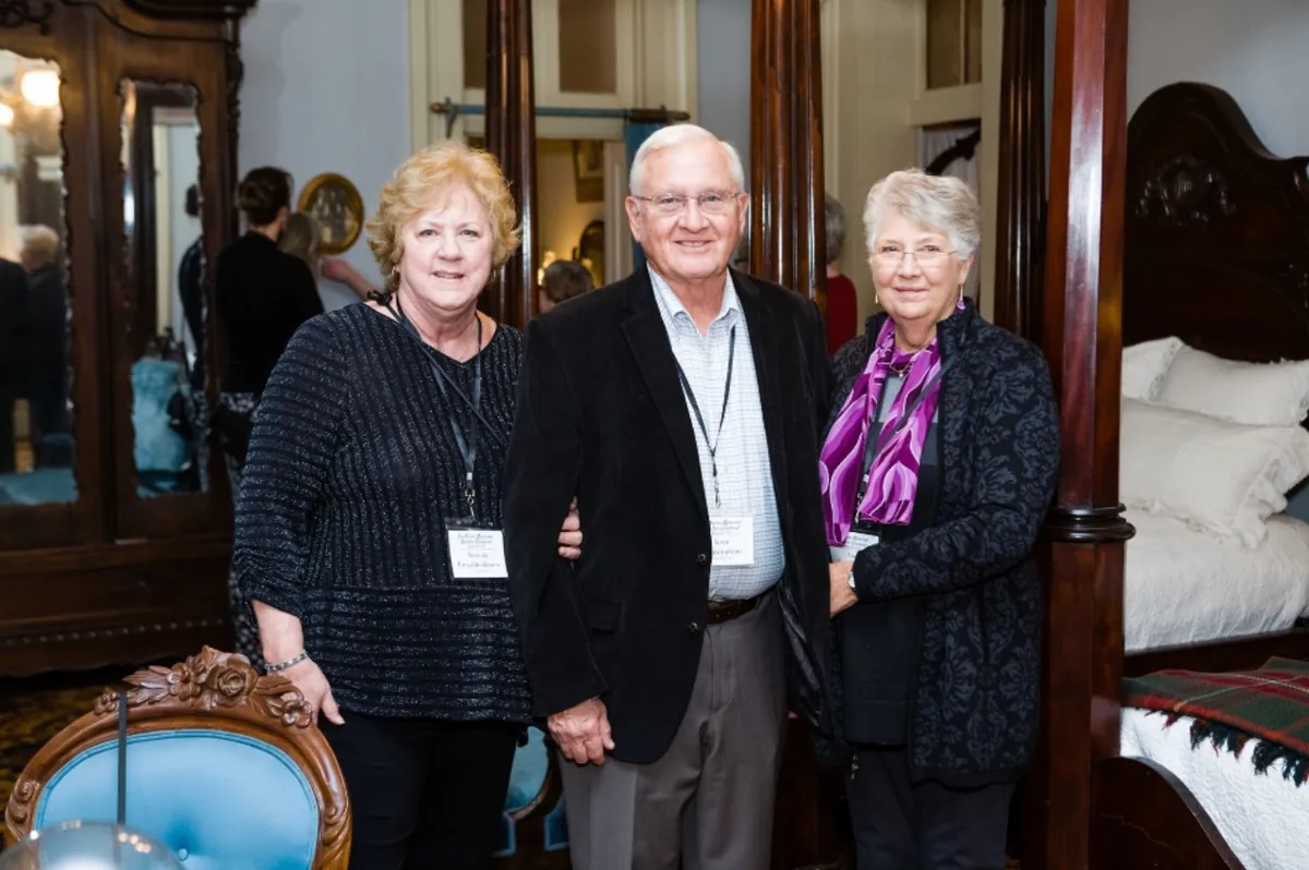 Three Southern Mansion Reader Weekend guests posing together in a historic bedroom