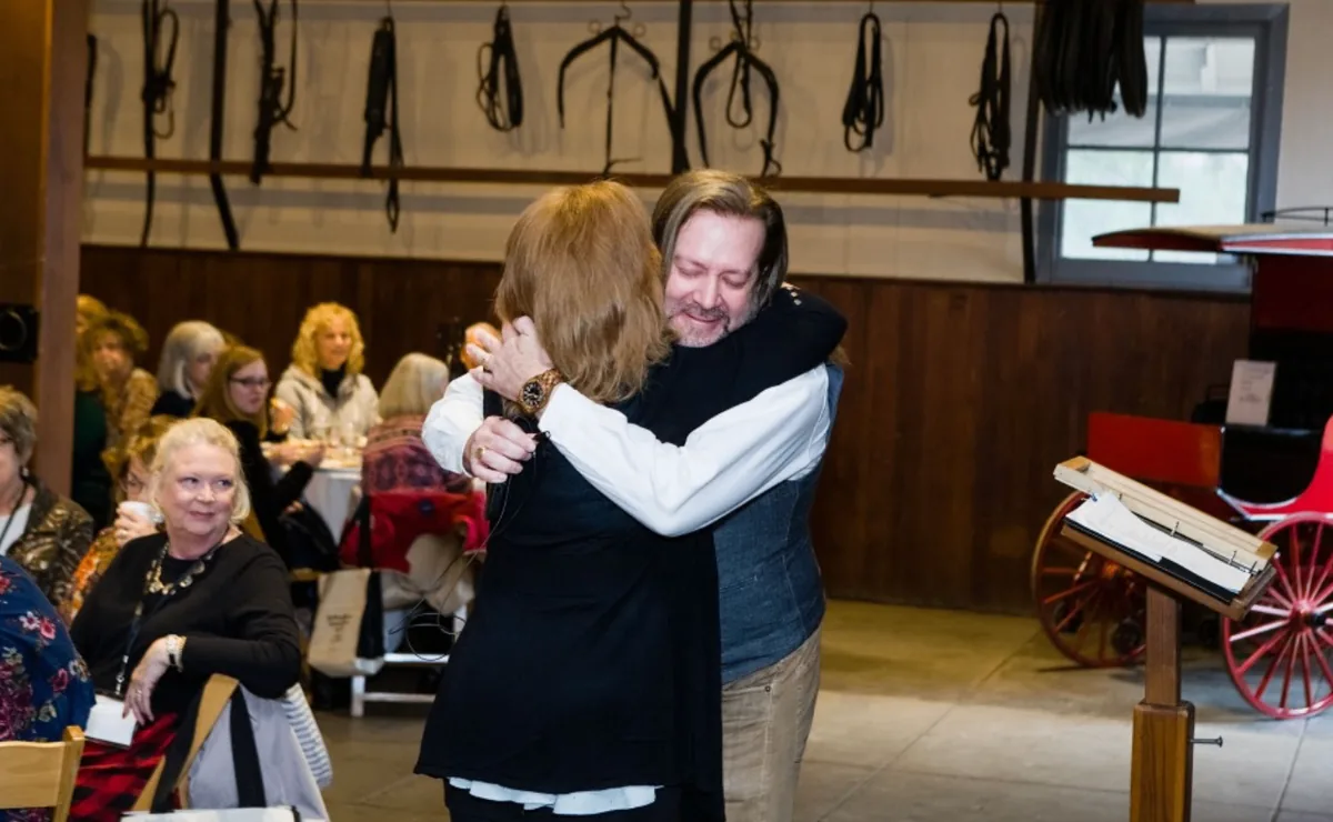 A warm embrace shared during the Southern Mansion Reader Weekend gathering
