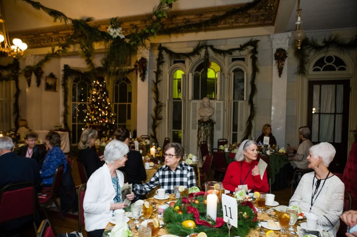 Readers seated for dinner inside Belmont Mansion during the Southern Mansion Reader Weekend