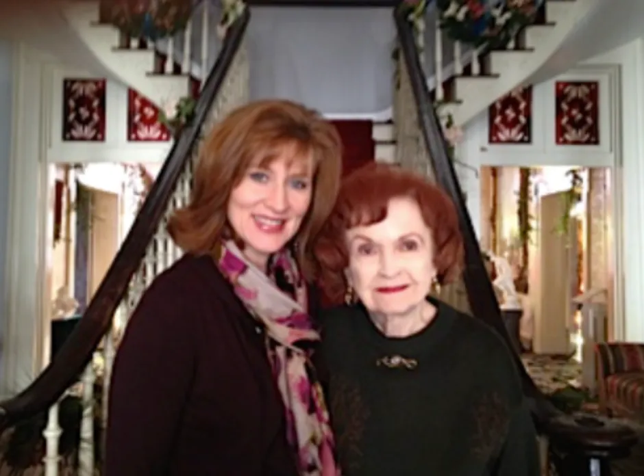 Tamera Alexander with Beverly Kaiser in front of Belmont Mansion's grand staircase.