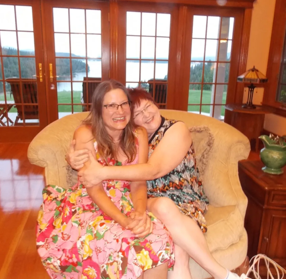 Two Coeur d'Alene Sisters seated together indoors during the retreat.