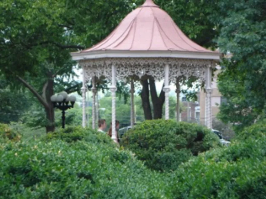 One of Belmont Mansion's ornate gazebos surrounded by greenery on the Belmont University campus.