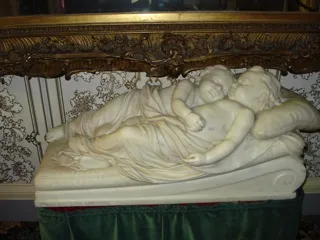 The Sleeping Children statue by William Rinehart displayed inside Belmont Mansion.